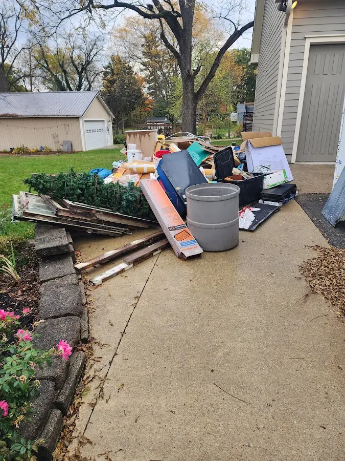 Dumpster being loaded with debris for Estate Cleanout Dumpster Rental in Columbus